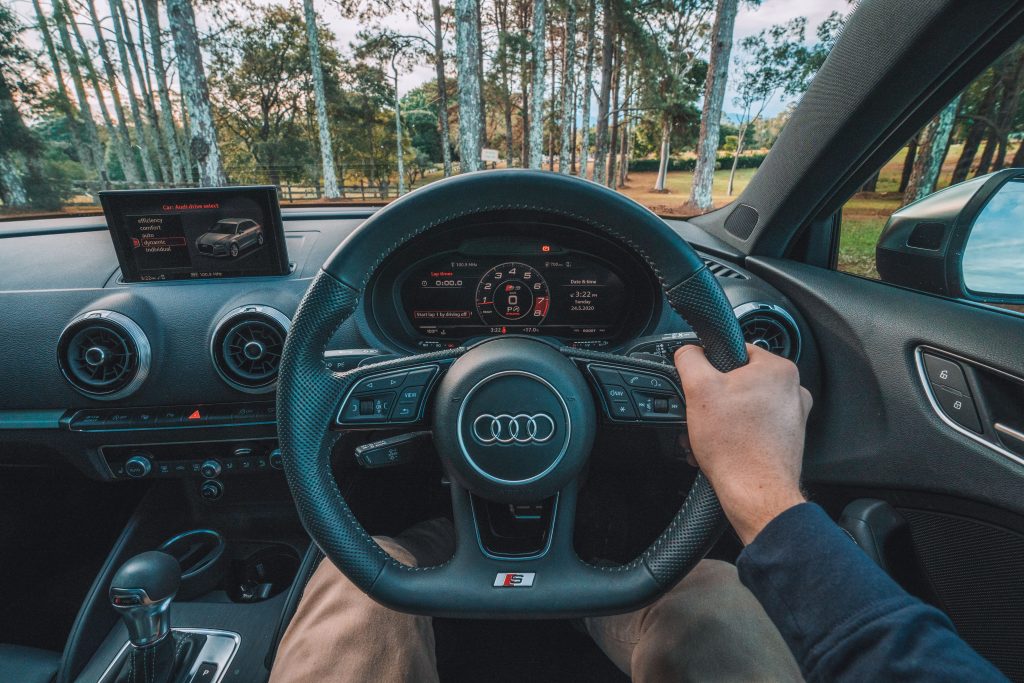 angus-gray-3qAq6Bqb1XM-unsplash Inside an Audi in a Forest