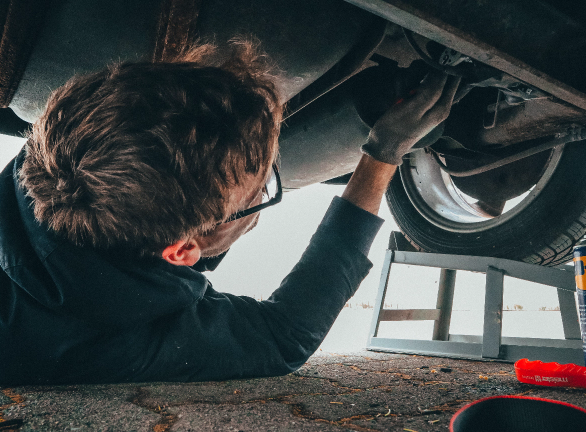pexels-malte-luk-2244746 Person Doing Mechanic Work Under a Car