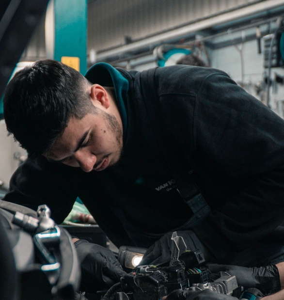 sten-rademaker-UZUzvJEvKnI-unsplash Mechanic working on a car